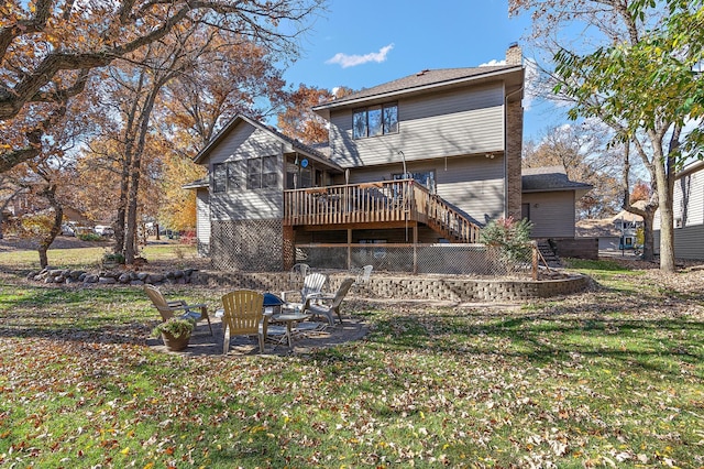 back of house featuring a patio, a yard, and a deck