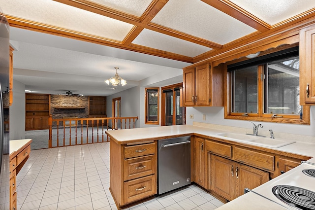 kitchen with kitchen peninsula, dishwasher, a textured ceiling, and sink