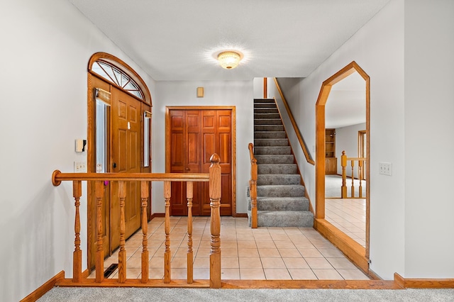 view of carpeted foyer