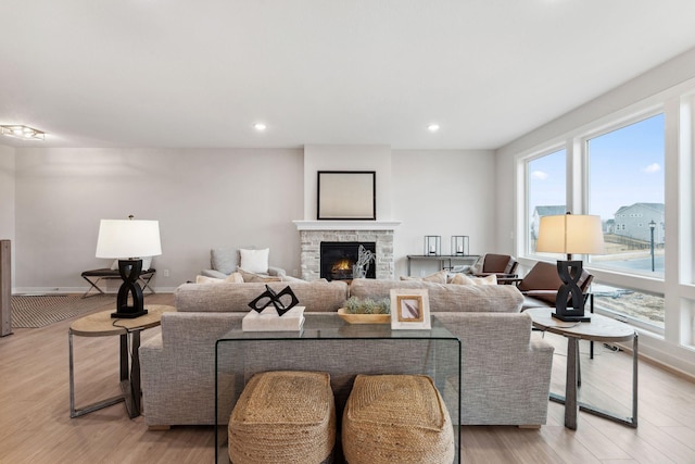 11728 35th St N, Lake Elmo, MN 55042 - living area with plenty of natural light, light wood-style floors, a fireplace, recessed lighting, and baseboards