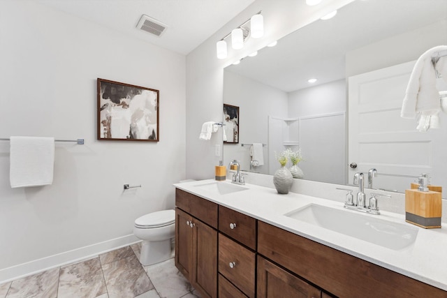 11728 35th St N, Lake Elmo, MN 55042 - bathroom with double vanity, baseboards, toilet, and a shower