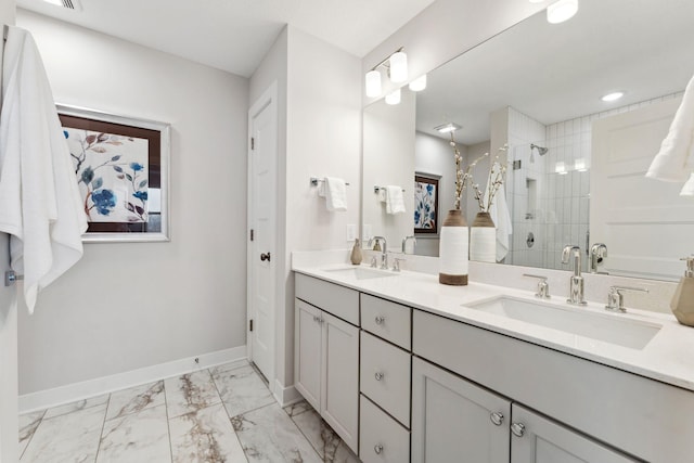11728 35th St N, Lake Elmo, MN 55042 - full bath with double vanity, a shower stall, baseboards, and marble look tile flooring