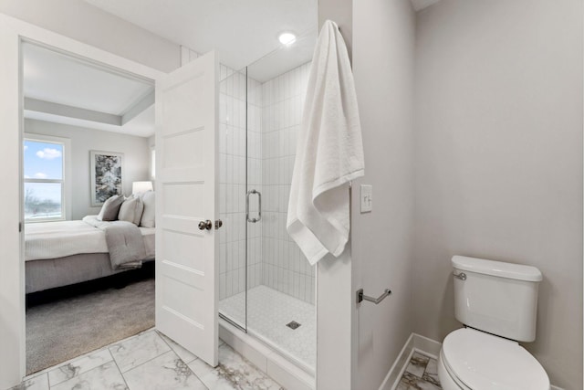 11728 35th St N, Lake Elmo, MN 55042 - ensuite bathroom with marble look tiles, a shower stall, toilet, and baseboards