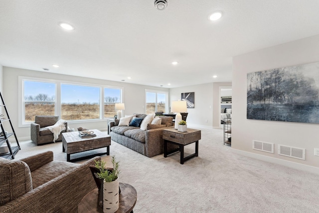 11728 35th St N, Lake Elmo, MN 55042 - living area with light colored carpet, recessed lighting, and baseboards