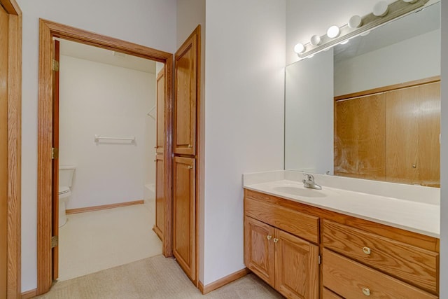 bathroom with vanity, toilet, and a washtub