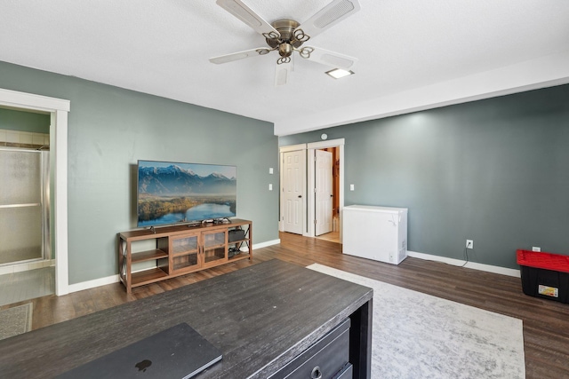 living room with ceiling fan and dark wood-type flooring