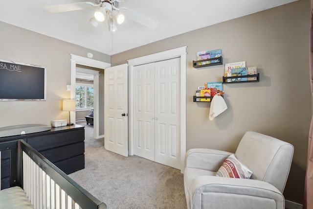 bedroom with light carpet, a closet, and ceiling fan