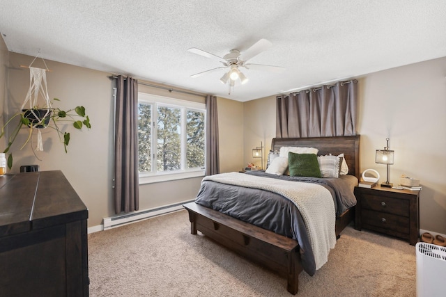 bedroom featuring ceiling fan, light colored carpet, a textured ceiling, and a baseboard heating unit