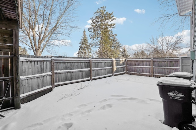 view of yard layered in snow