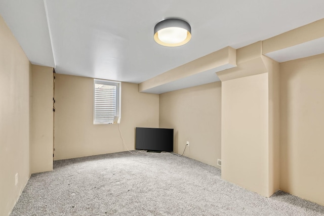 basement with light colored carpet