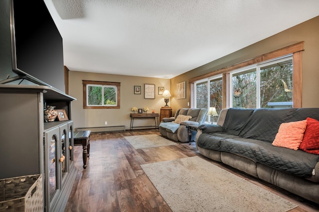 living room with a textured ceiling, a baseboard radiator, and dark wood-type flooring