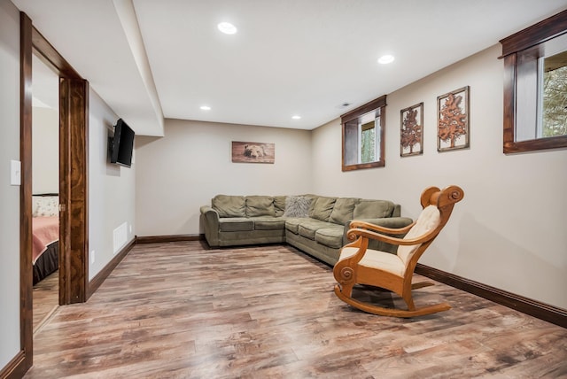 living room with light hardwood / wood-style floors