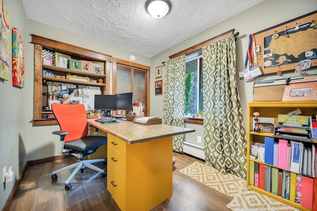 office area featuring a baseboard radiator, dark hardwood / wood-style floors, and a textured ceiling