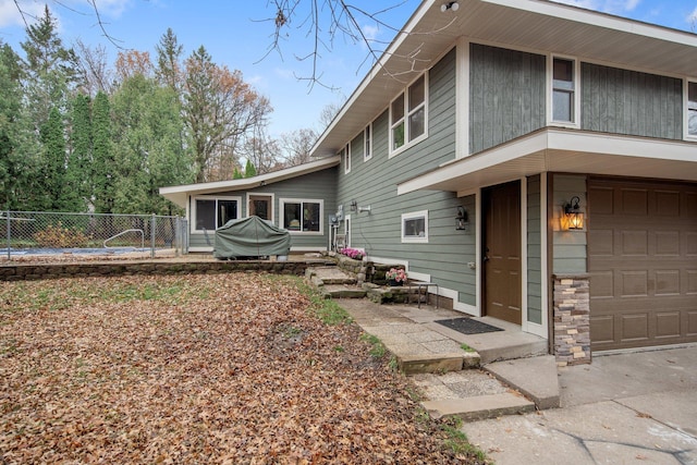 back of property featuring a garage