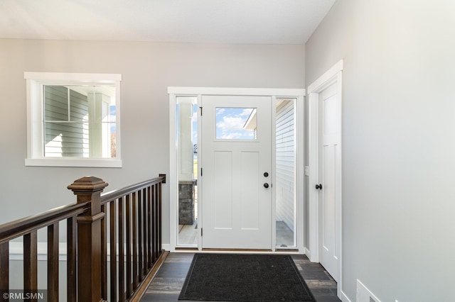 foyer featuring dark wood-type flooring