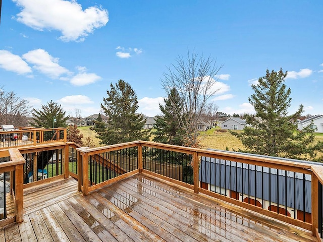 wooden deck featuring a residential view