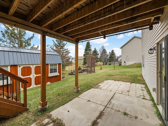 view of patio / terrace featuring an outbuilding