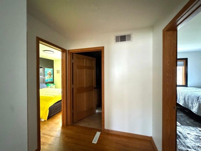 corridor featuring light wood-type flooring