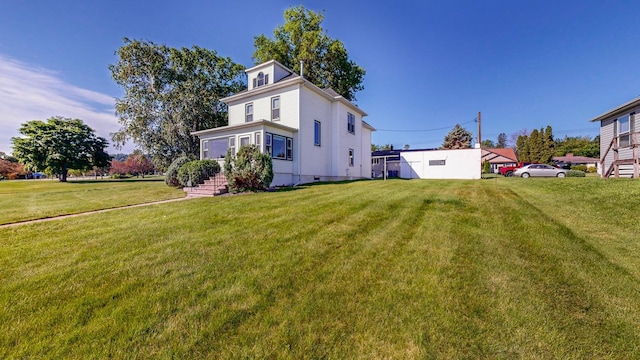 view of property exterior featuring a lawn