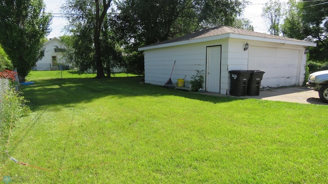 view of yard featuring an outbuilding and a garage