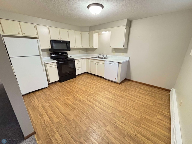 kitchen with light hardwood / wood-style floors, white cabinetry, black appliances, and a textured ceiling