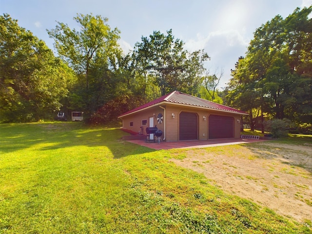 garage with a lawn