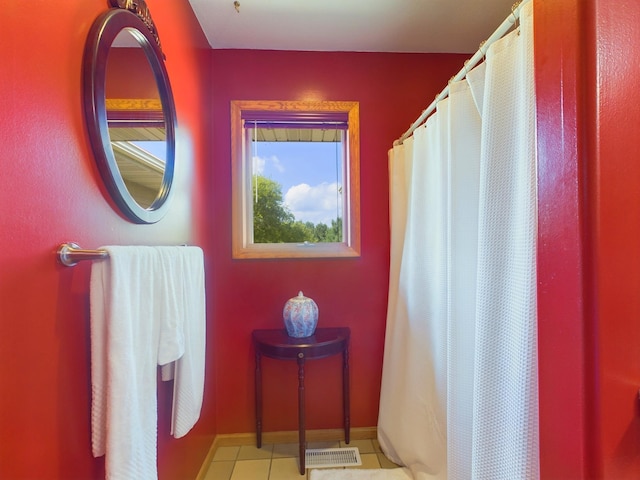 bathroom with tile patterned floors