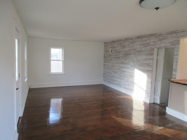 spare room with dark hardwood / wood-style floors