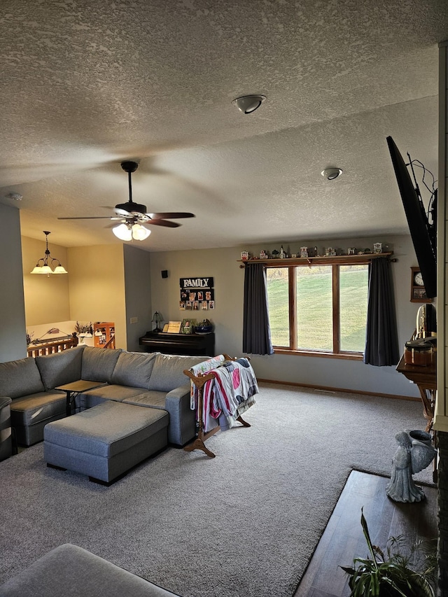 carpeted living room with ceiling fan