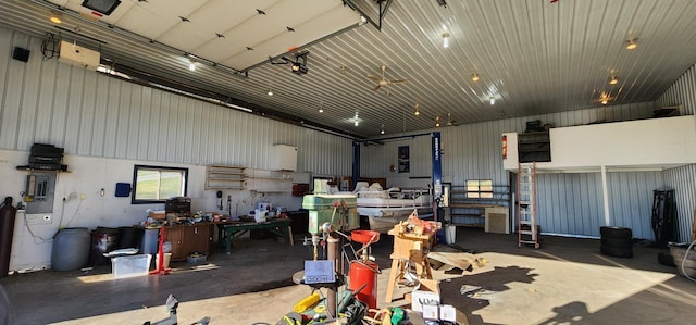 garage featuring a garage door opener and a workshop area