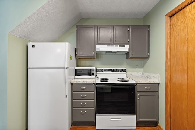 kitchen featuring gray cabinets, light hardwood / wood-style floors, white appliances, and vaulted ceiling