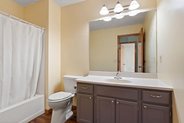 full bathroom featuring hardwood / wood-style flooring, vanity, toilet, and shower / tub combo