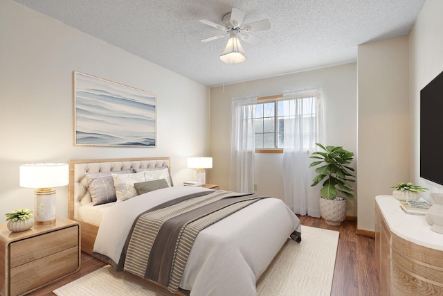 bedroom with dark wood-type flooring, ceiling fan, and a textured ceiling