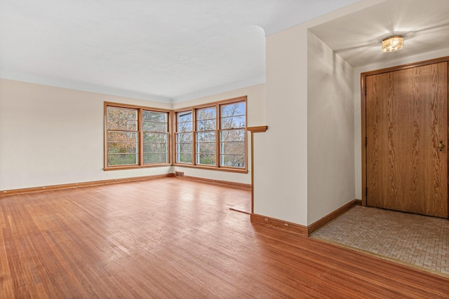 spare room with hardwood / wood-style flooring