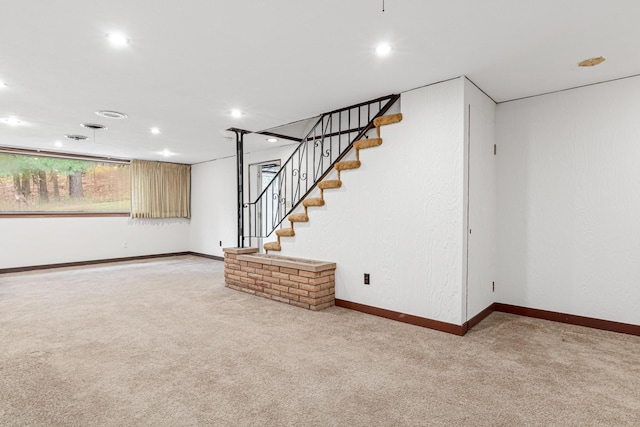 basement with light colored carpet