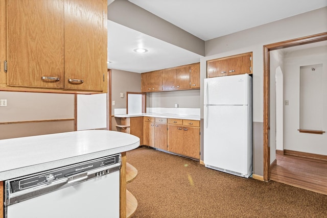 kitchen with white refrigerator and dishwasher