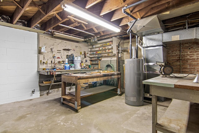 basement featuring a workshop area and gas water heater