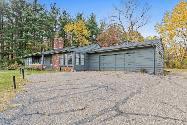 single story home featuring a garage