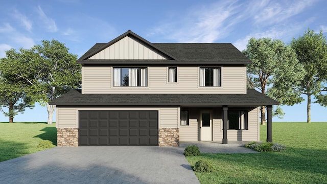 view of front of house featuring a front yard and a garage