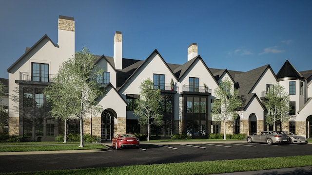 9910 Crestwood Ter Unit 2, Eden Prairie, MN 55347 - view of front facade with stone siding, stucco siding, and uncovered parking