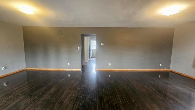 empty room with wood-type flooring