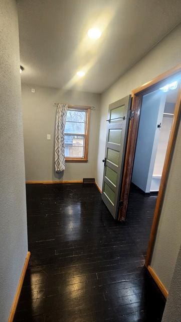 empty room featuring dark hardwood / wood-style flooring