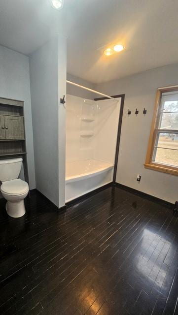 bathroom with walk in shower, wood-type flooring, and toilet