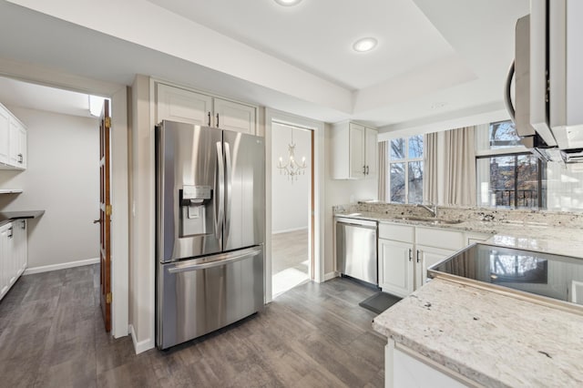 kitchen with white cabinets, stainless steel appliances, dark wood-type flooring, and sink