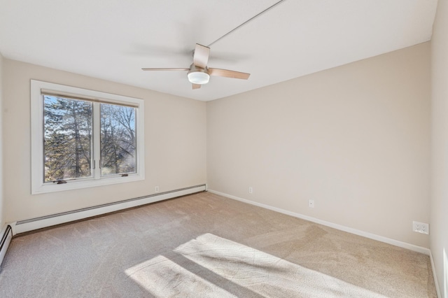 empty room with ceiling fan, baseboard heating, and light carpet