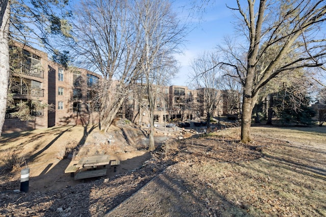 view of yard with a balcony