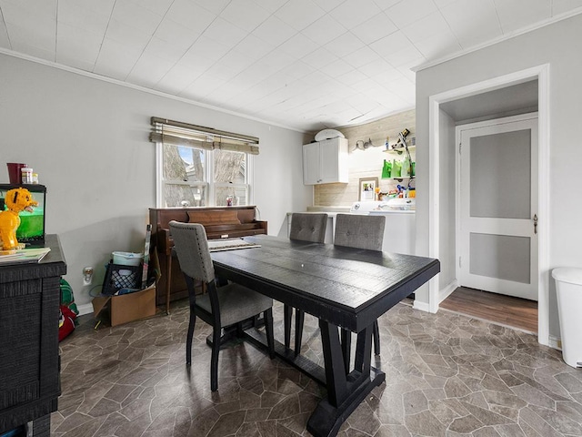 dining room featuring crown molding and dark wood-type flooring