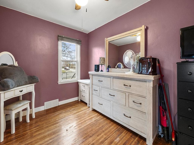 interior space with ceiling fan and light hardwood / wood-style floors