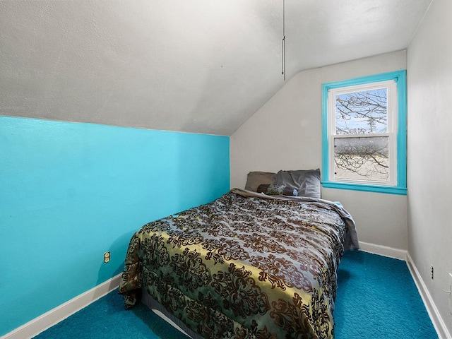 carpeted bedroom featuring vaulted ceiling