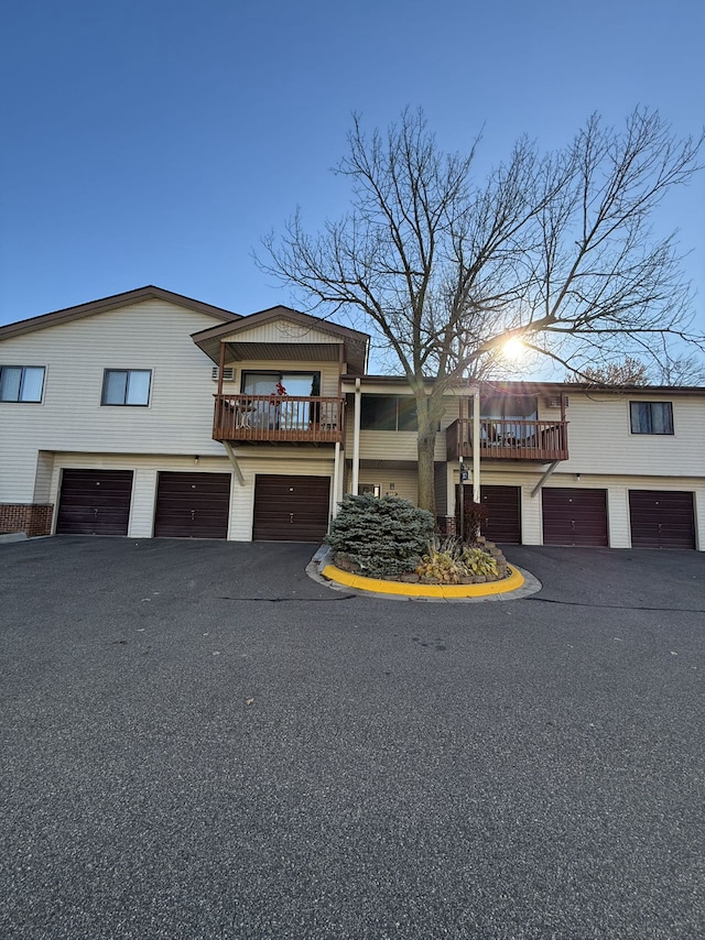 view of front facade featuring a garage and a deck